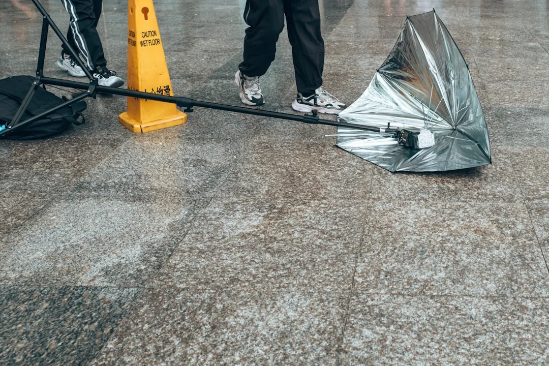 A worker in protective gear is disinfecting a kitchen to help maintain a clean, safe environment.